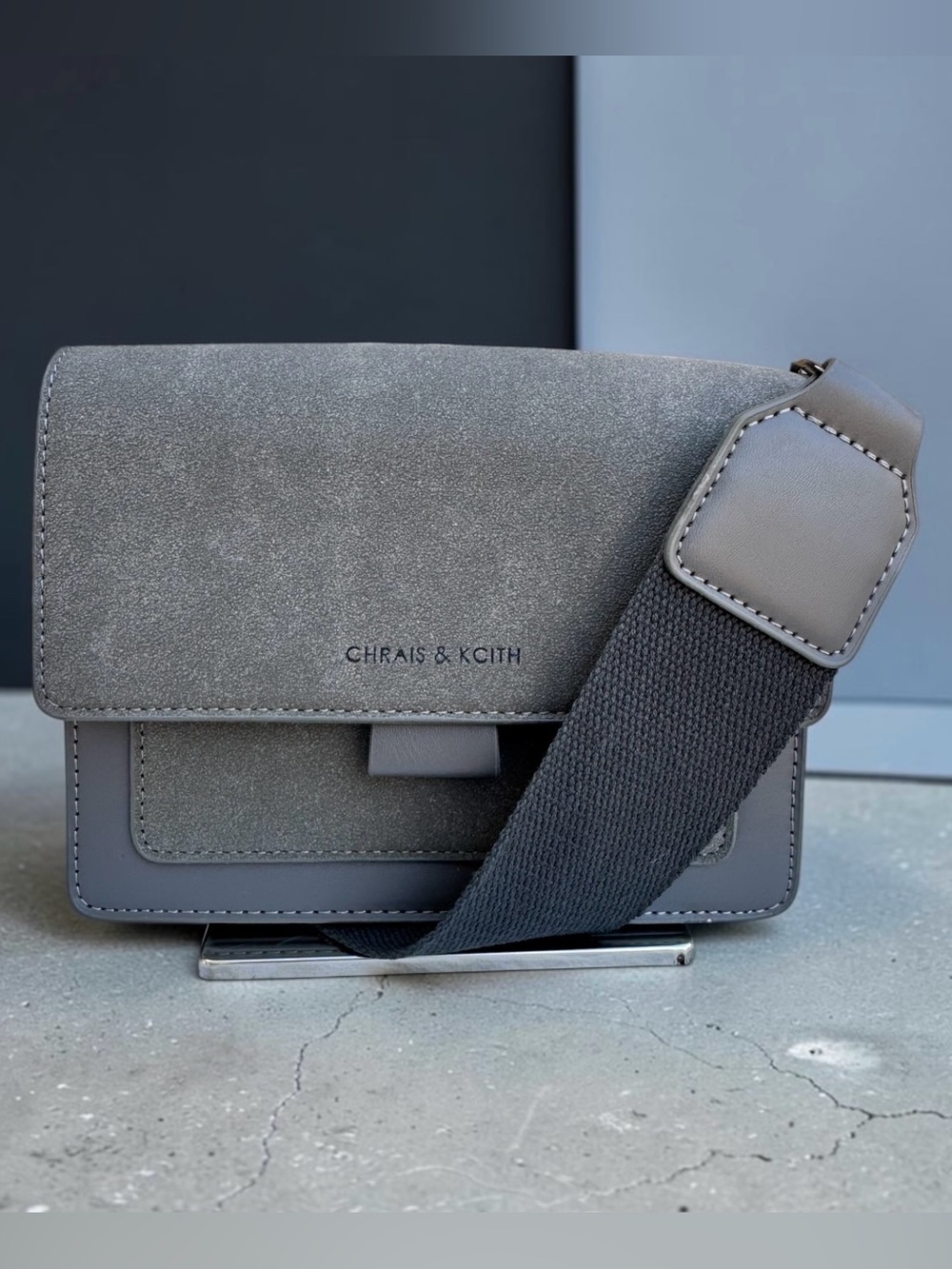 CHRAIS & KCITH Grey Suede Crossbody Bag with Guitar Strap.